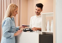 Patient using card to pay for treatment