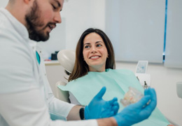 Dentist and patient talking during consultation