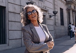 Confident senior businesswoman outside of office building