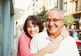 Father and adult daughter, both possible candidates for dental implants