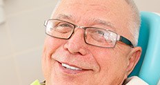 Smiling older man in dental chair