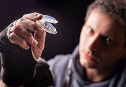 Male athlete holding his mouthguard