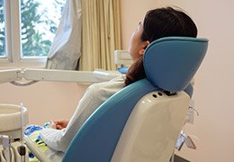 Patient in dental exam chair