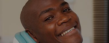 Smiling man in dental chair