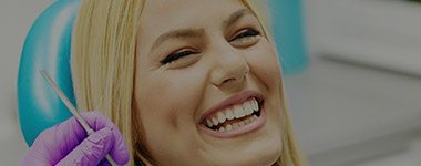 Woman laughing in dental chair