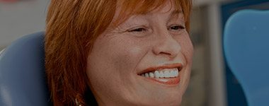 Older woman smiling in dental chair