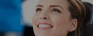 Young woman smiling in dental chair