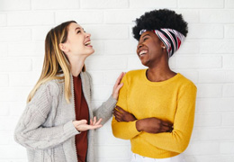 Two friends enjoying happy conversation