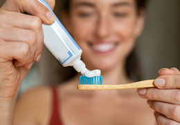 Woman preparing to brush her teeth