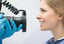 Woman having images taken of her smile