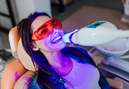 Patient undergoing in-office teeth whitening treatment