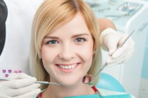 Smiling woman in the dental chair. 