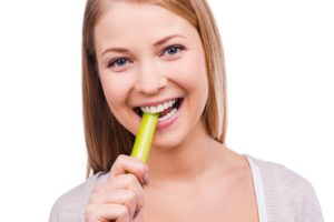 woman eating celery