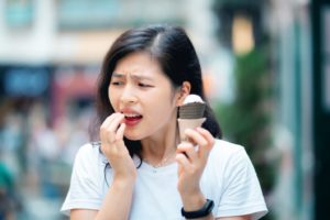 woman with ice cream and toothache