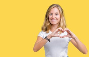woman making heart with hands