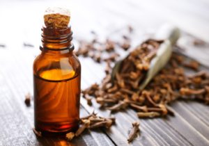 bottle of clove oil, an at-home toothache remedy