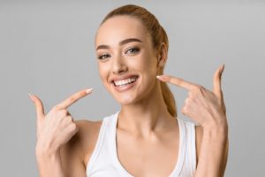 Happy woman enjoying benefits of porcelain veneers in Prestonsburg