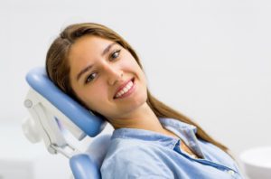 Happy patient, smiling after overcoming her dental fear