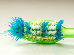 Frayed toothbrush, a sign of brushing your teeth too hard