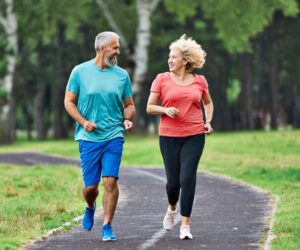Mature couple jogging outdoors 