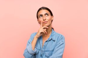 Woman wearing curious, thoughtful expression 